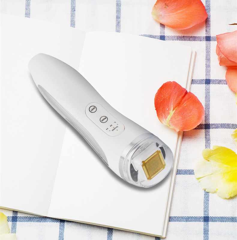 ZENEVIVE Lift heat lifting facial device on linen with flower petals